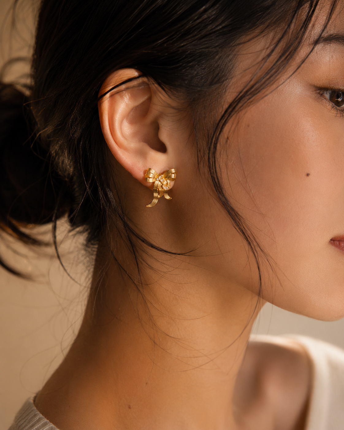 Minimal gold bow earrings for daily wear