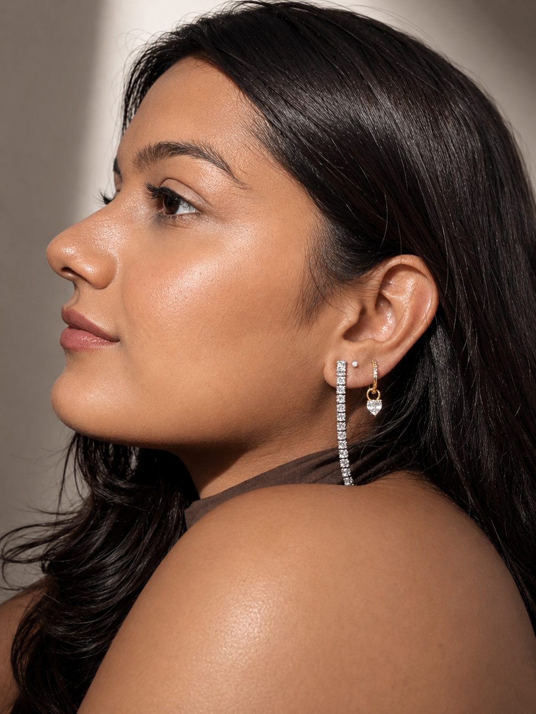 Minimal gold heart huggie earrings for daily wear
