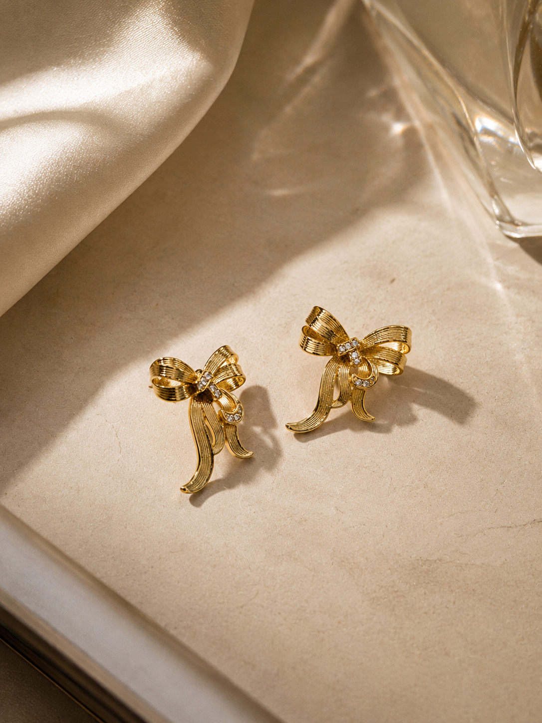 Minimal gold bow earrings for daily wear