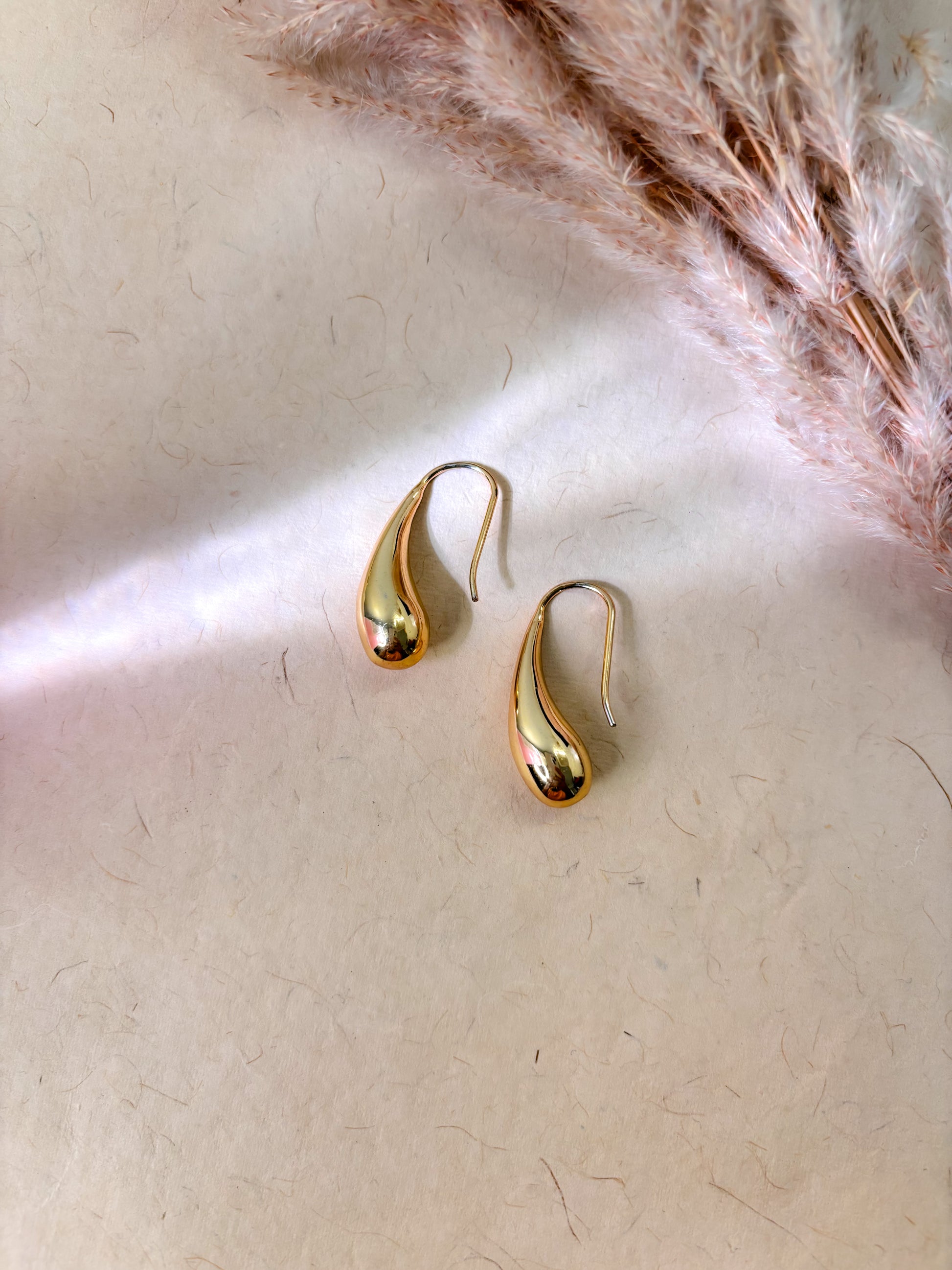 Minimal gold huggie earrings for daily wear