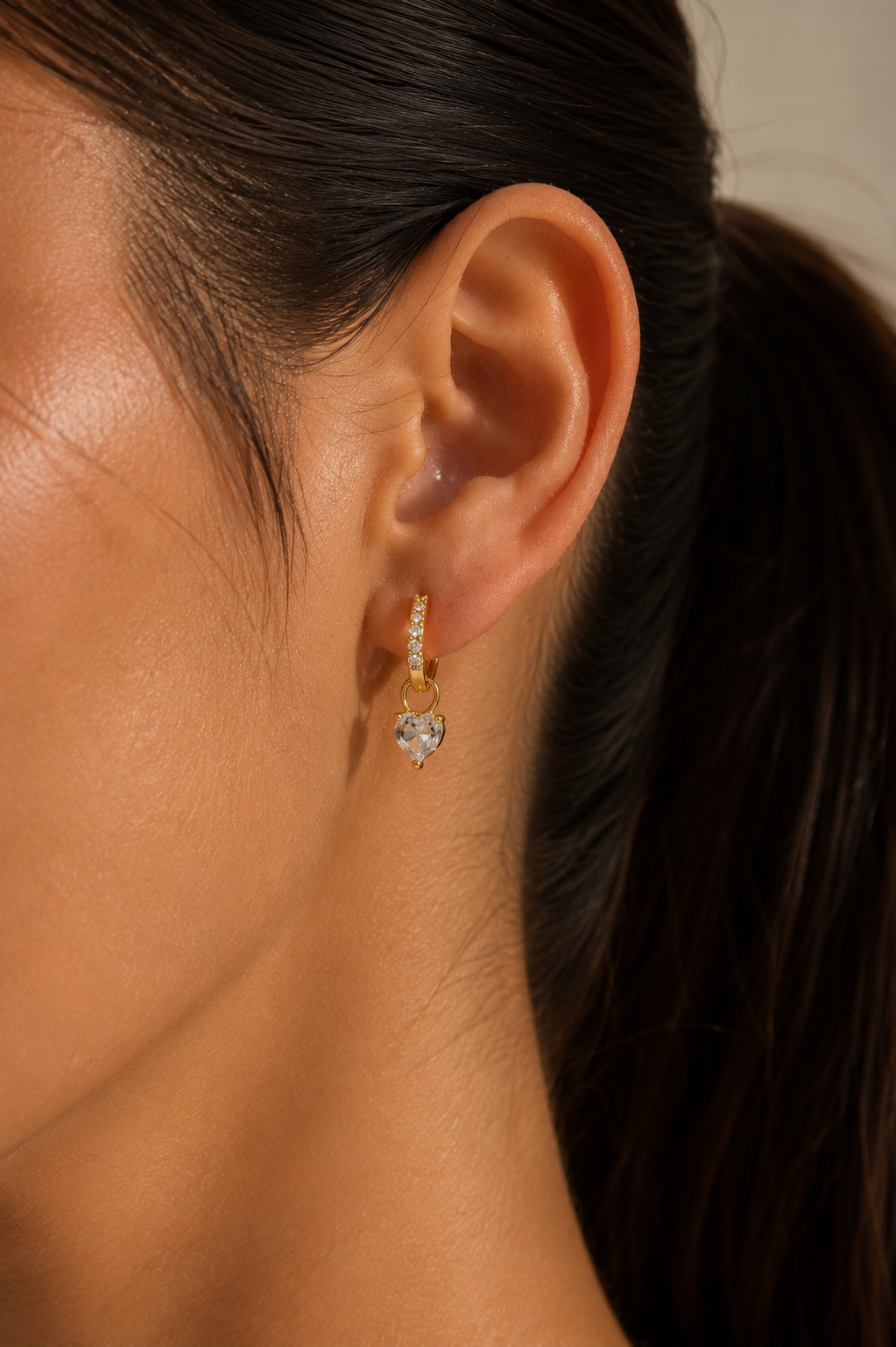 Minimal gold heart huggie earrings for daily wear